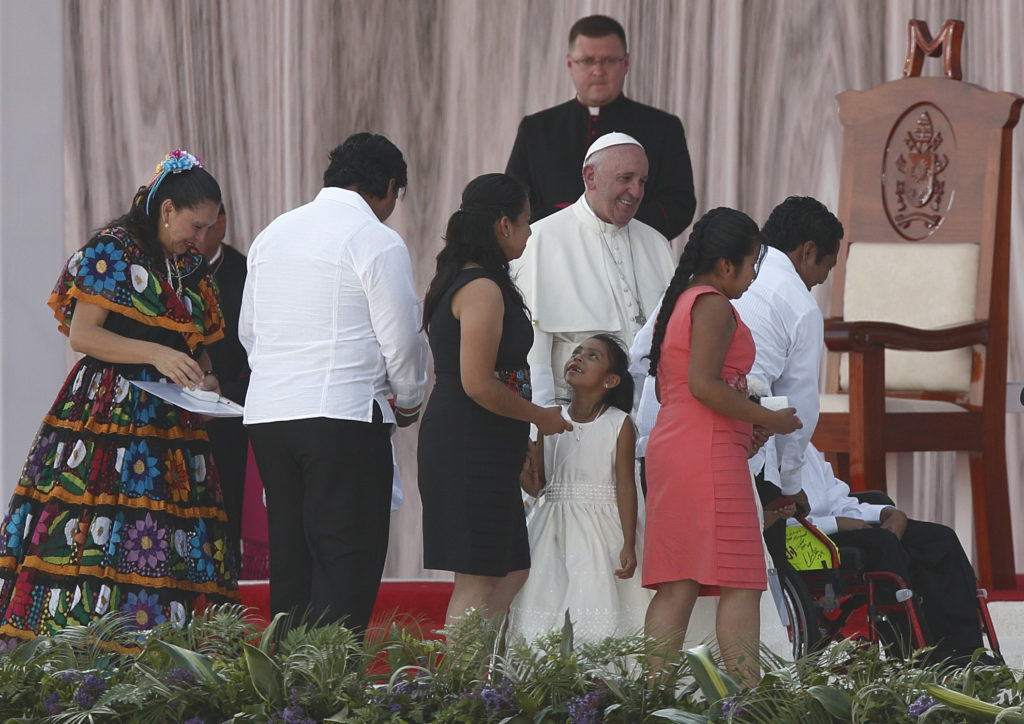 Pope Francis greets people during a meeting with families at the Victor Manuel Reyna Stadium in Tuxtla Gutierrez, Mexico, Feb. 15. (CNS photo/Paul Haring) 