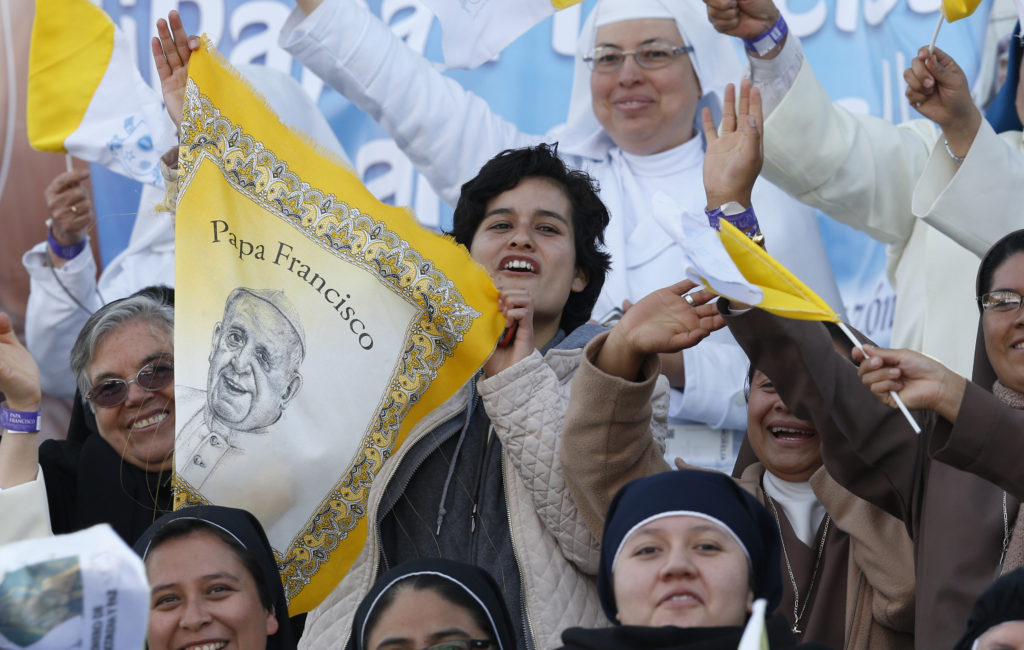 People cheer before Pope Francis' arrival to celebrate Mass with priests and religious at a stadium in Morelia, Mexico, Feb. 16. (CNS photo/Paul Haring)