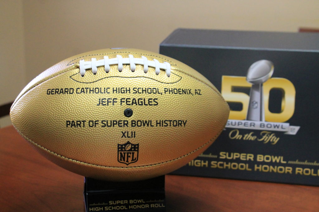 A golden football honoring Jeff Feagles and Gerard Catholic High School was given to the Diocese of Phoenix Catholic Schools Office to commemorate Super Bowl 50. (Tony Gutierrez/CATHOLIC SUN)
