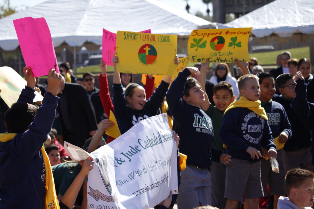 Students from Ss. Simon and Jude Cathedral School hold signs at the Catholic Schools Week rally at Wesley Bolin Plaza in front of the Arizona Capitol Feb. 3. (Ambria Hammel/CATHOLIC SUN)