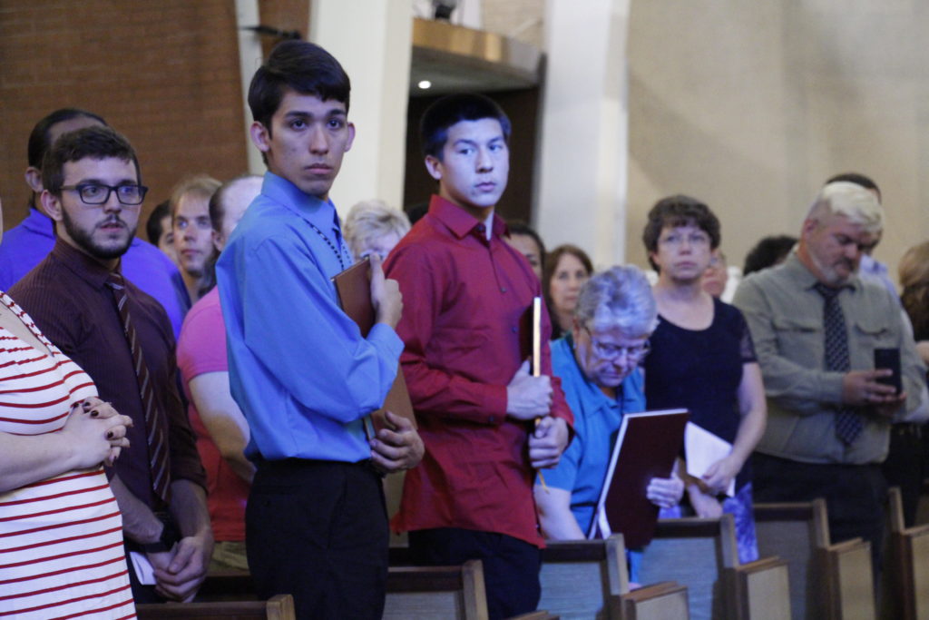 Students in the Rite of Christian Initiation program at parishes throughout the Diocese of Phoenix await Bishop Thomas J. Olmsted's procession into Ss. Simon and Jude Cathedral Feb. 14. (Ambria Hammel/CATHOLIC SUN)
