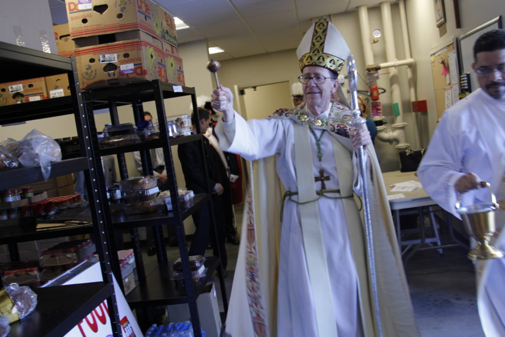 Bishop Thomas J. Olmsted blesses the expanded food pantry for St. Vincent de Paul outreach at St. Francis Xavier Jan. 24. (Ambria Hammel/CATHOLIC SUN)