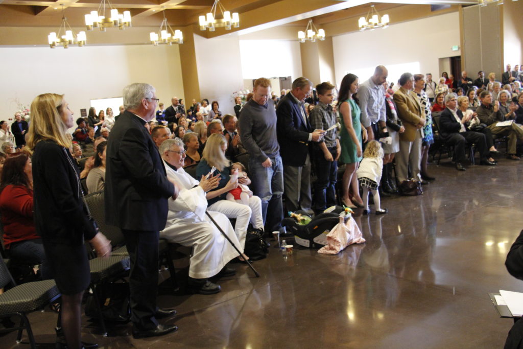 The crowd applauds the financial support of the Anderson Family Foundation during the blessing of St. Francis Xavier Parish hall Jan. 24. (Ambria Hammel/CATHOLIC SUN)