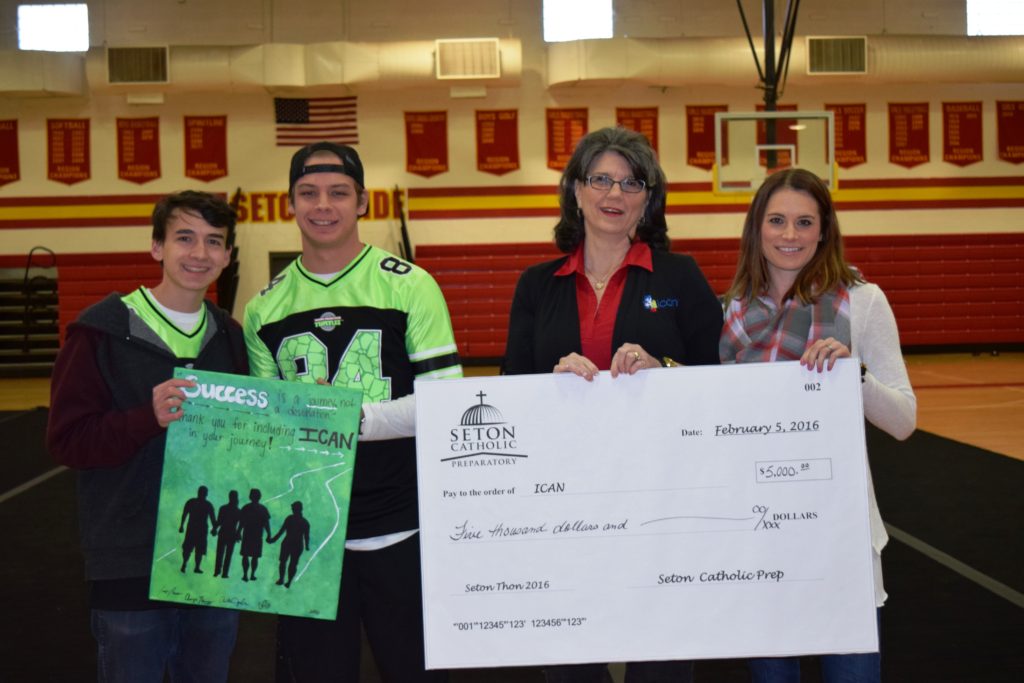 Seton Catholic Preparatory students presented a $5,000 check Feb. 5  to Becky Jackson, chief executive officer for ICAN in Chandler, and Melissa Kowalski, a Seton alumna now serving as chief programs officer for ICAN, (courtesy photo)