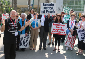 An unidentified priest leads a demonstration against the death penalty Feb. 27 as part of the Los Angeles Religious Education Congress in Anaheim, Calif. (CNS photo/J.D. Long-Garcia, The Tidings) 