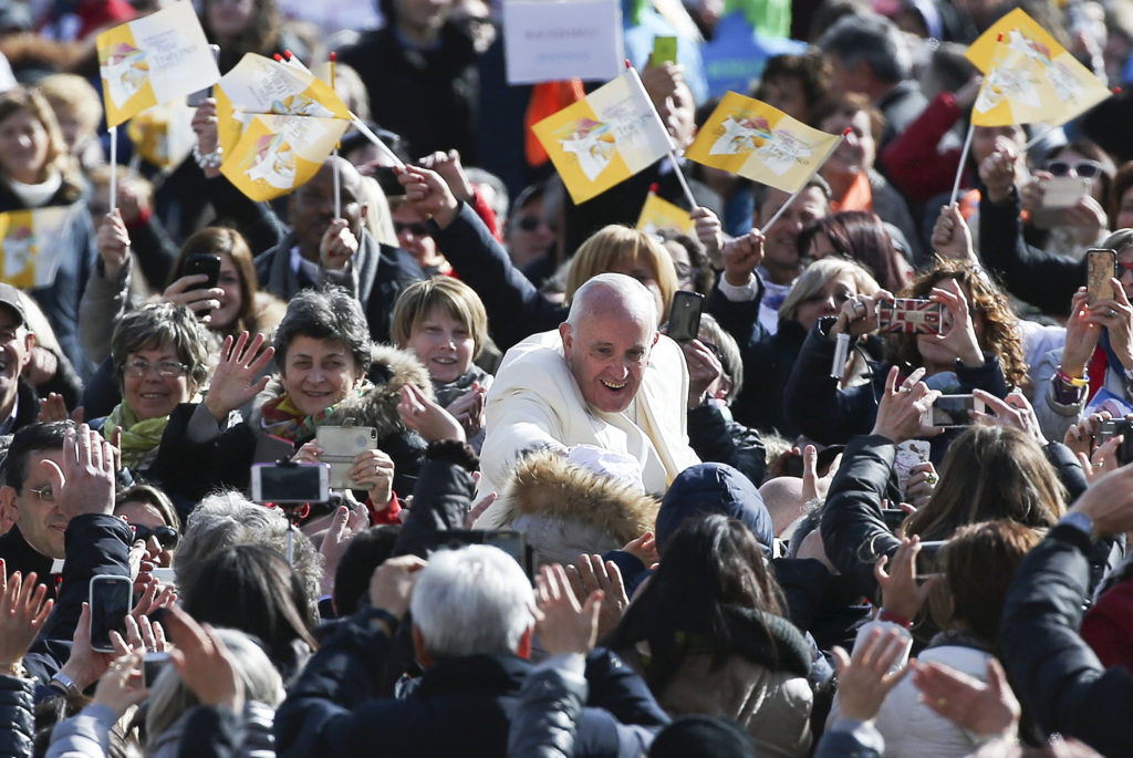 Pope Francis waves as he arrives to lead a jubilee audience in St. Peter's Square at the Vatican March 12. (CNS photo/Alessandro Bianchi, Reuters) 