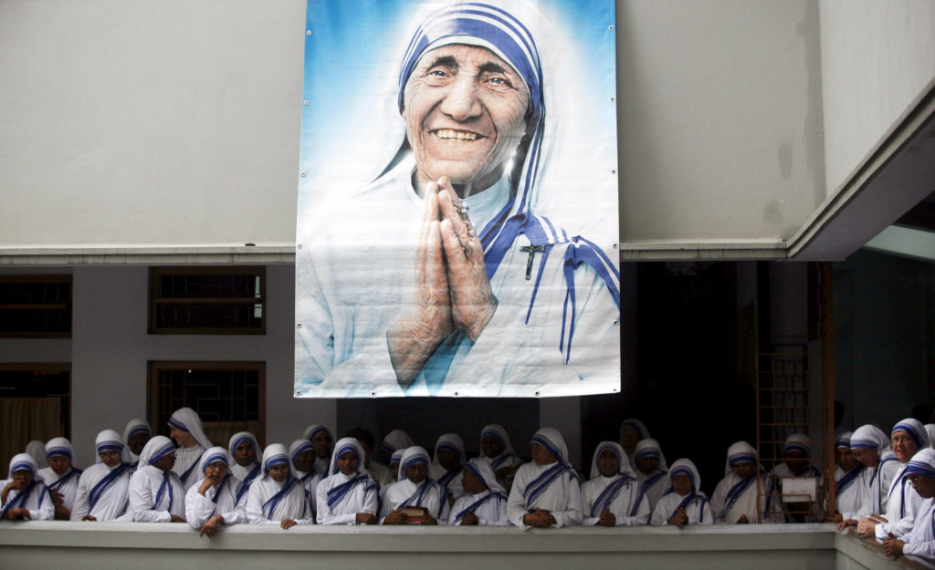 A poster of Blessed Teresa of Kolkata and Missionaries of Charity are seen in Kolkata, India, in this Sept. 5, 2007, file photo. Pope Francis will declare her a saint at the Vatican Sept. 4, the conclusion of the Year of Mercy jubilee for those engaged in works of mercy. (CNS photo/Jayanta Shaw, Reuters) 