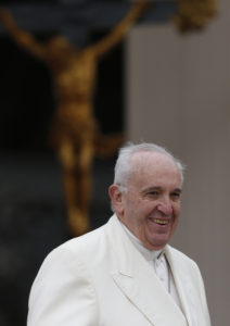 Pope Francis smiles as he leaves his general audience in St. Peter's Square at the Vatican March 23. (CNS photo/Paul Haring) 