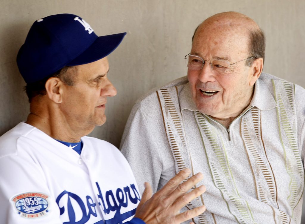 Los Angeles Dodgers head coach Joe Torre talks to Joe Garagiola before playing the Chicago White Sox in a 2010 spring training baseball game in Glendale, Ariz. Garagiola, a legendary broadcaster and former baseball player, died March 23 at age 90 in Scottsdale, Ariz. (CNS photo/Rick Scuteri, Reuters) 