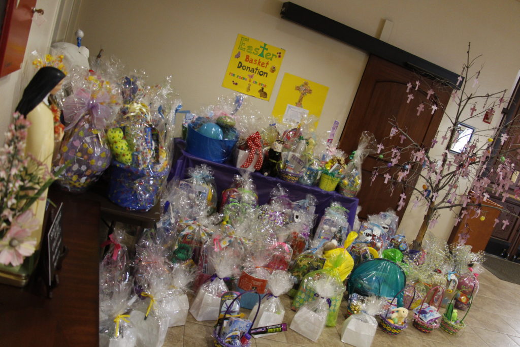 The St. Gerard Circle at Corpus Christi Parish spearheaded its annual Easter basket collection yielding 130 baskets for a March 23 delivery to a nearby elementary school. (Ambria Hammel/CATHOLIC SUN)