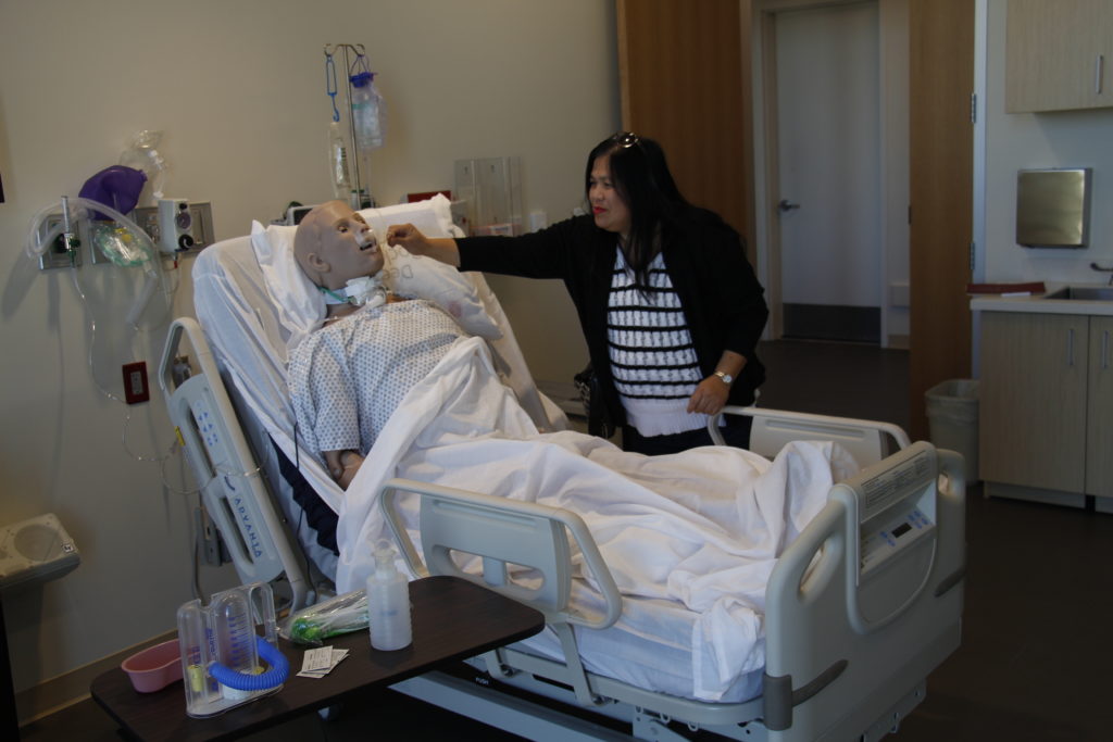 Jocelyn Railsback, who plans to be among the first nursing students at Saint Xavier University in Gilbert, explores one of its simulation labs. (Ambria Hammel/CATHOLIC SUN)