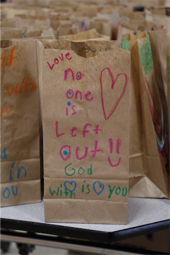 St. John Vianney preschoolers and kindergarteners and some older art students decorated 900 lunch bags to distribute to André House guests April 13. (Ambria Hammel/CATHOLIC SUN)