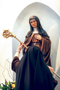 Mother Marie André, as abbess, accdets the crozier of St. Clare of Assisi, a symbol of her authority over and service to the Desert Nuns’ monastery. (Photo courtesy of John Bering)