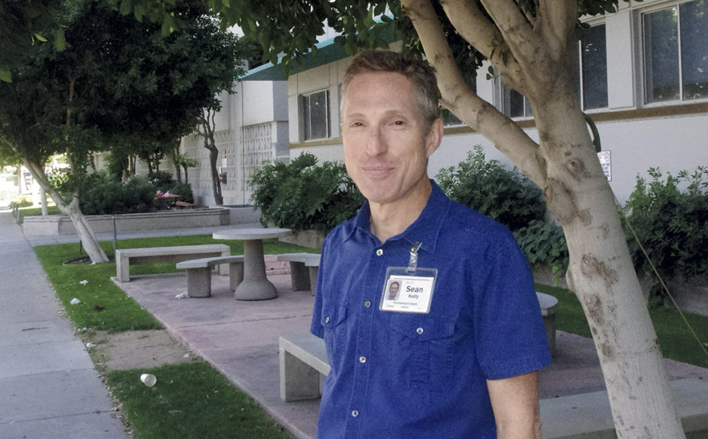 Sean Kelly, once an avowed atheist, now spends his free time sharing the joy and truth of the Catholic faith with complete strangers who wander past the St. Paul's Street Evangelization's table in downtown Tempe. (Joyce Coronel/CATHOLIC SUN)