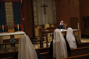 Sr. Magdalene, superior at the Sisters of Life's Visitation Mission on New York's East Side, exposes the Blessed Sacrament during a midday Holy Hour May 4. (CNS photo/Gregory A. Shemitz) 