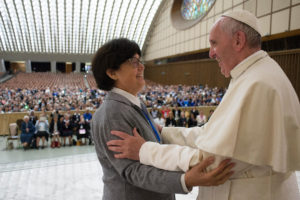 Pope Francis greets Sister Carmen Sammut, president of the International Union of Superiors General, during an audience with the heads of women's religious orders in Paul VI hall at the Vatican May 12. During a question-and-answer session with members of the UISG, the pope said he was willing to establish a commission to study whether women could serve as deacons. (CNS photo/L'Osservatore Romano) 