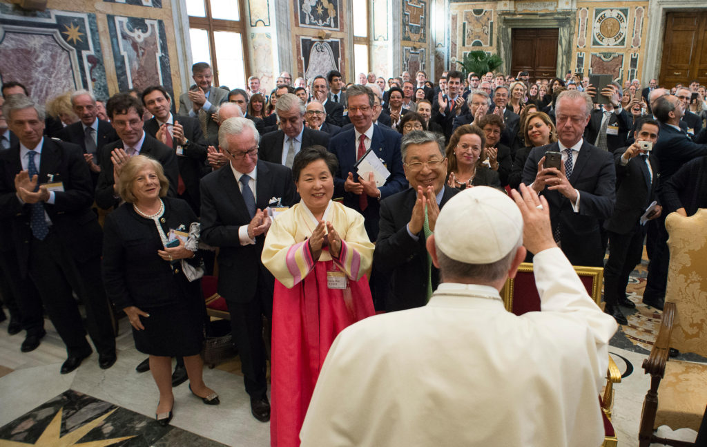Pope Francis greets business leaders and Catholic social teaching experts during an audience at the Vatican May 13. Those at the audience were attending a conference sponsored by the Centesimus Annus Pro Pontifice Foundation. (CNS photo/L'Osservatore Romano) 