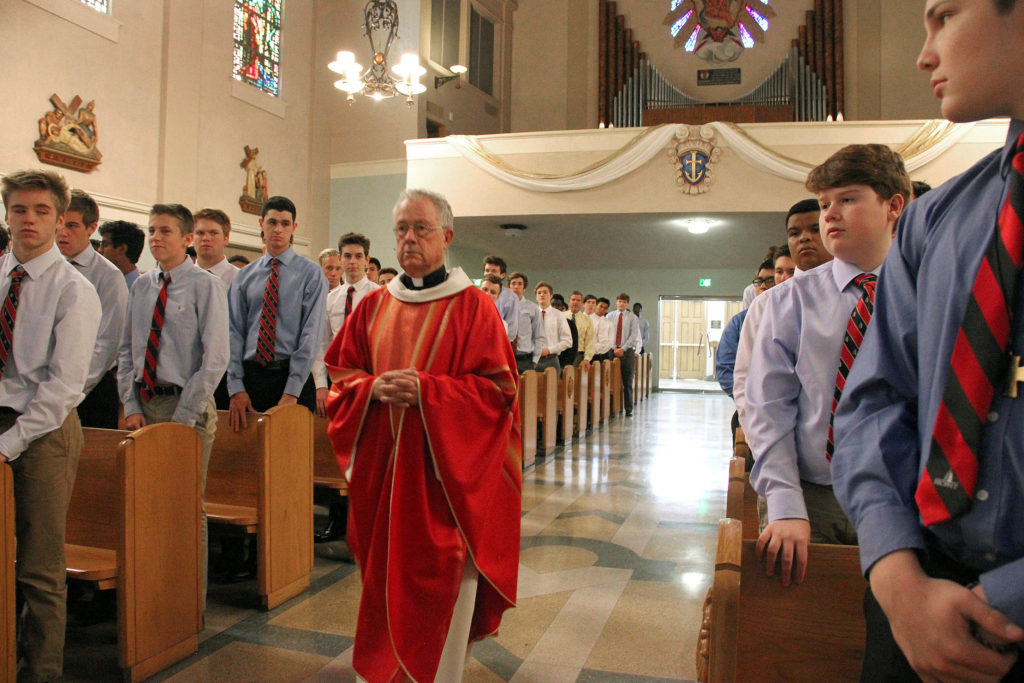 Jesuit Father Eddie processes into St. Francis Xavier April 15 during the last all-school Mass he will celebrate as president of neighboring Brophy College Preparatory. (photo courtesy of Hunter Franklin/Brophy College Preparatory)
