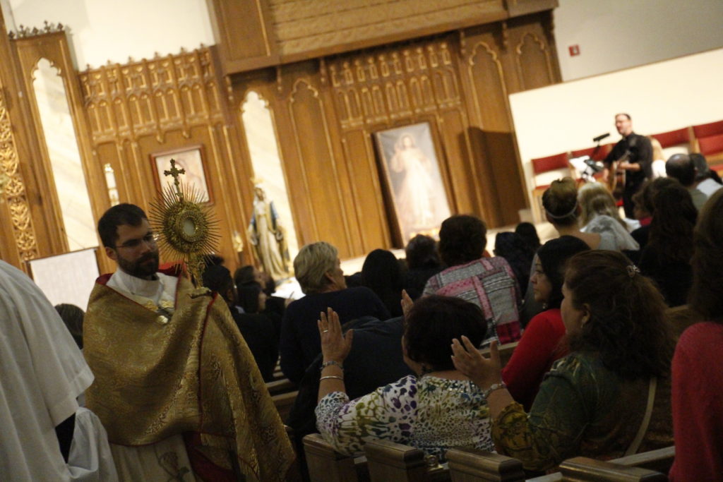 Catholics yearning for inner peace filled St. Joan of Arc Parish May 6 for the latest “Mercy Night.” Some stood in praise and worship, others knelt in prayer while many awaited their turn for reconciliation with the Lord. (Ambria Hammel/CATHOLIC SUN)