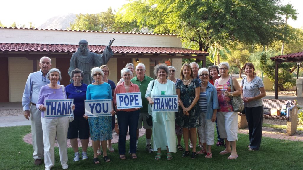 Members of the Franciscan Renewal Center's Care for Creation and Franciscan Action Network teams posed for a photo in 2015 the day 'Laudato Si'' was released. They plan to be out again during hospitality times before and after Mass sharing an overview of the encyclical in honor of its anniversary. (photo courtesy of The Casa)