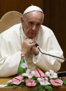 Pope Francis addresses mayors from around the world at a workshop on climate change and human trafficking in the synod hall at the Vatican last July. Local government leaders were invited by the pontifical academies of sciences and social sciences to sign a declaration recognizing that climate change and extreme poverty are influenced by human activity. (CNS photo/Paul Haring) 