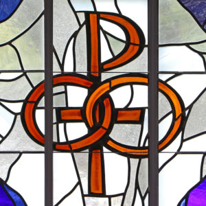 A pair of wedding bands symbolizing the sacrament of marriage is depicted in a stained-glass window at St. Patrick Church in Smithtown, N.Y. (CNS photo/Gregory A. Shemitz) 