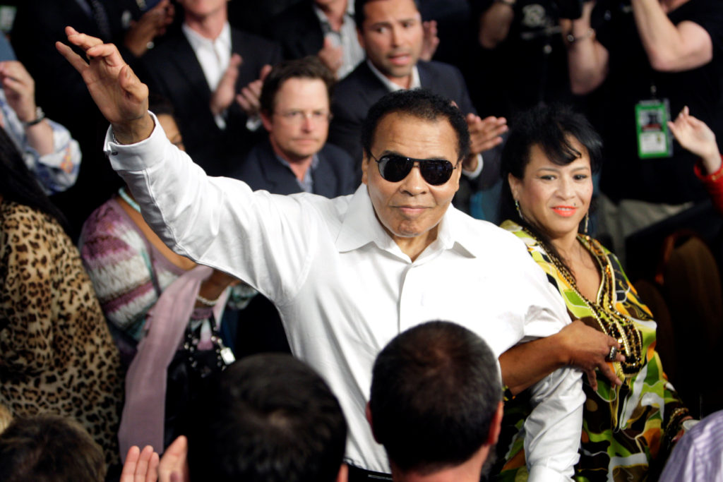 Boxing legend Muhammad Ali stands with his wife, Yolanda, as he is introduced before the 2010 welterweight fight between Floyd Mayweather Jr. and Shane Mosley at the MGM Grand Garden Arena in Las Vegas. Ali died June 3 at age 74 after a long battle with Parkinson's disease. (CNS photo/Steve Marcus, Reuters) 