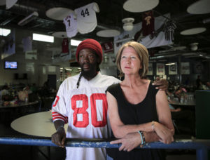 Charone and Lisa Williams sought refuge from the hot streets June 4 in the dining hall of the Society of St. Vincent de Paul in Phoenix. The couple said they had been "bouncing around" friends' homes and shelters in the Phoenix metro area since March as they wait for available Section 8 housing. Charone struggles will mental illness and he's not suppose to be in the heat or sun with the medication he takes. (CNS photo/Nancy Wiechec) 