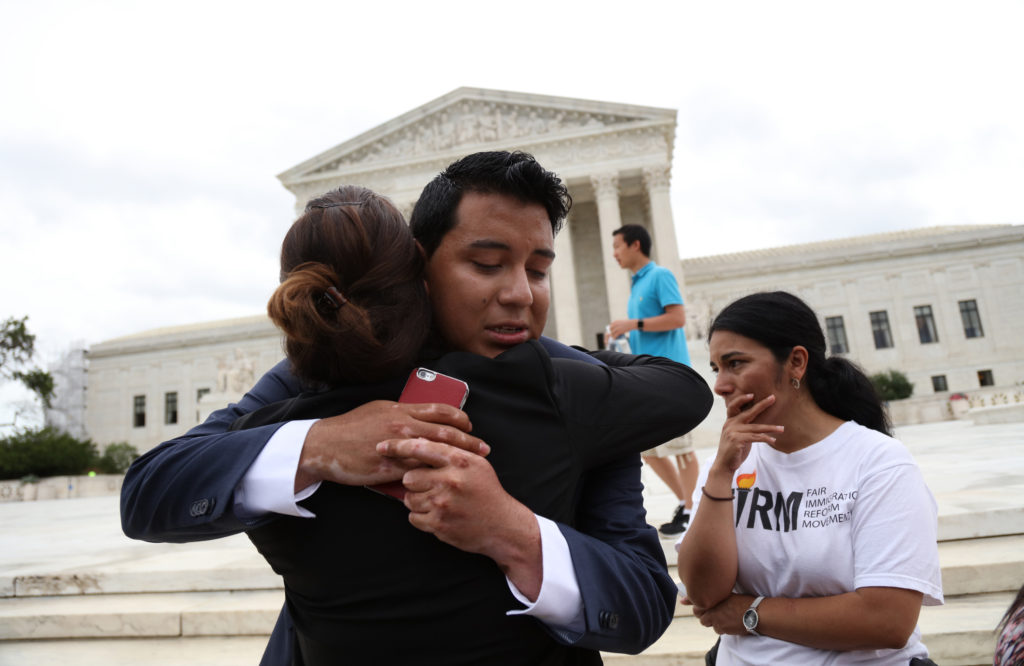 Advocates for immigration reform react June 23 outside the U.S. Supreme Court in Washington after the justices issued a 4-4 split ruling on President Barack Obama's executive actions on immigration, leaving in place a lower court ruling that blocked Obama's policies (CNS photo/Andrew Gombert, EPA) 