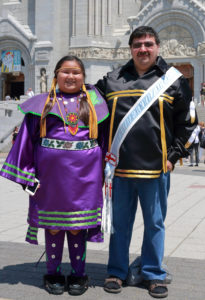 Blair Paul and his daughter, Jada, pose for a photo outside the Basilica of Sainte Anne-de-Beaupre in Quebec June 26. They are native people of the Membertou First Nation in Nova Scotia. (CNS photo/Philippe Vaillancourt, Presence)