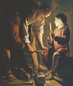 In this 1640s painting by French painter Georges de Latour, Saint Joseph, patron of carpenters, works a beam before the Child Jesus who seems already to see the wood of the cross. (Public Domain)