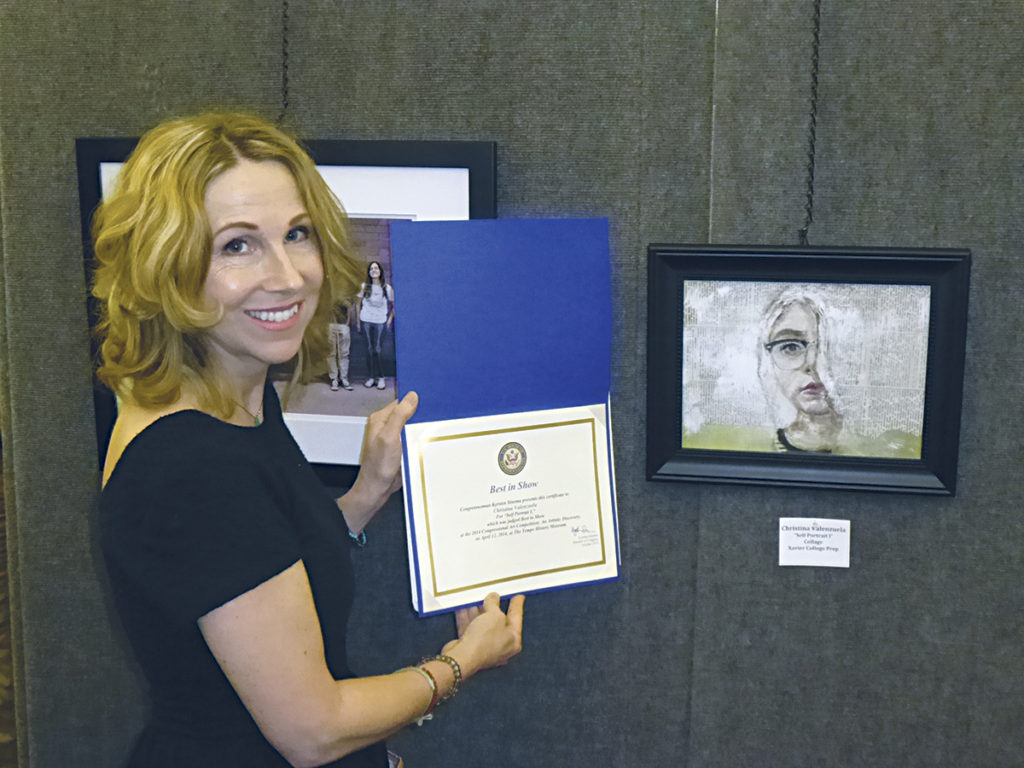 Alison Dunn, an art teacher and department co-chair at Xavier College Preparatory, holds a student’s 2014 “Best of Show” award at the district level of the Congressional Art Exhibition. The honor propelled a June 23 national speaking engagement. (courtesy photo)