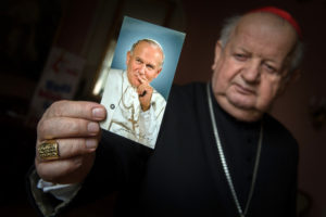 Cardinal Stanislaw Dziwisz of Krakow, Poland, holds a picture of St. John Paul II at his residence in Krakow March 4. Cardinal Dziwisz was the personal secretary of the late pope. World Youth Day, the nearly weeklong international Catholic youth gathering, concludes July 31. (CNS photo/Marcin Mazur, Bishops' Conference of England and Wales) 