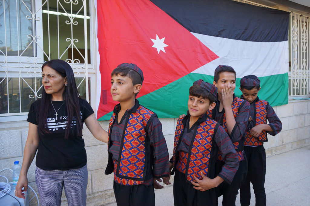 Syrian refugee boys line up to perform folk dances during a graduation ceremony at the Latin Patriarchate School in Naour, Jordan, July 11. (CNS photo/Dale Gavlak) 