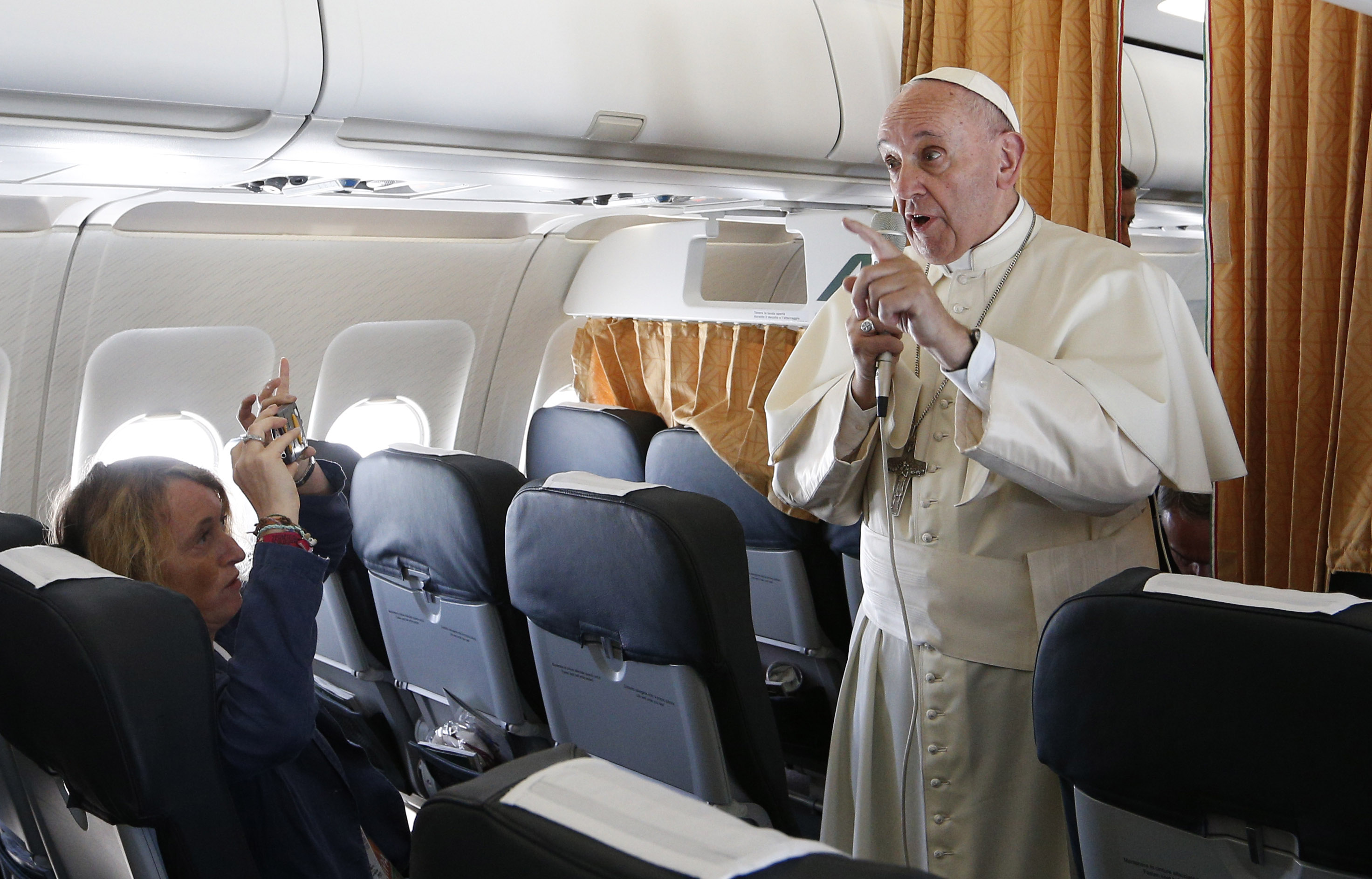 Pope Francis speaks to journalists aboard his flight from Rome to Krakow, Poland, July 27. The pope is attending World Youth Day in Krakow. (CNS photo/Paul Haring)