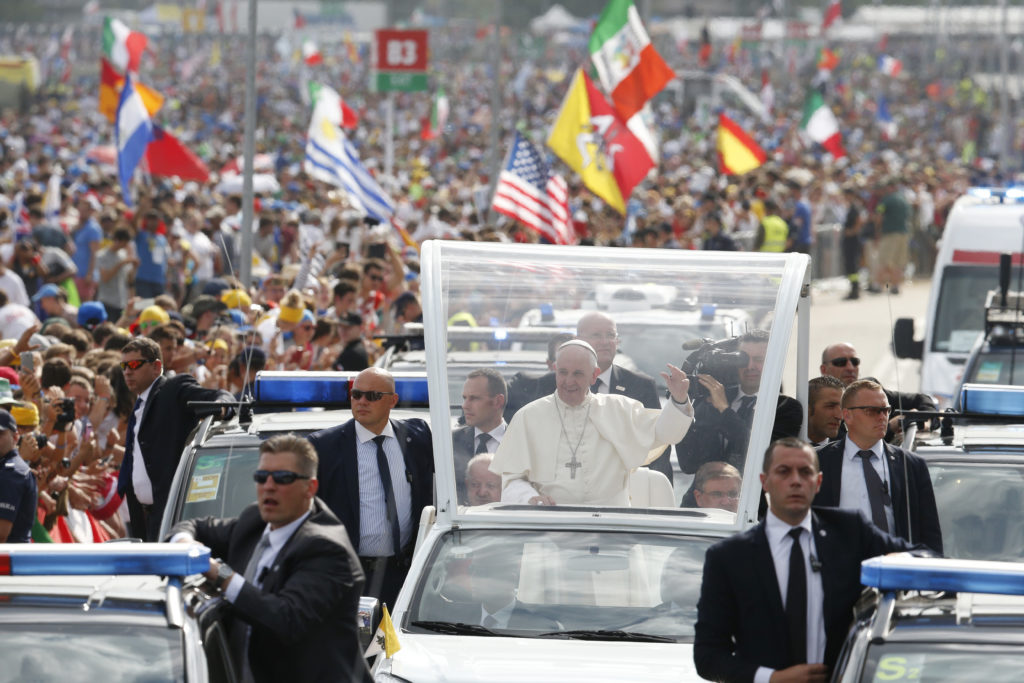 Pope Francis greets the crowd as he arrives to celebrate the closing Mass of World Youth Day at Campus Misericordiae in Krakow, Poland, July 31. (CNS photo/Paul Haring)