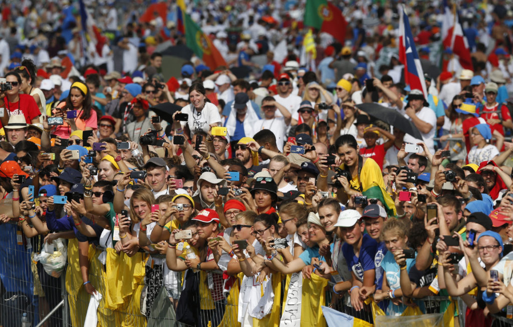 The crowd reacts as Pope Francis arrives to celebrate the closing Mass of World Youth Day at Campus Misericordiae in Krakow, Poland, July 31. (CNS photo/Paul Haring)