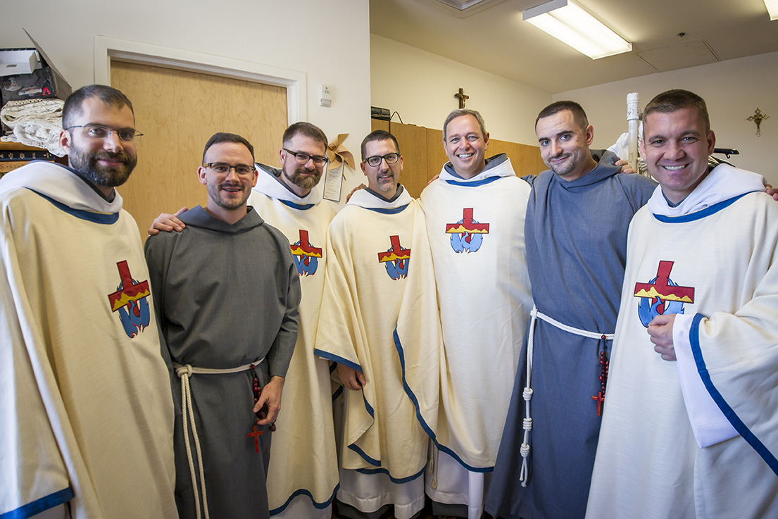 After receiving their new names, but before thee Mass where they took their vows, the Franciscan Friars of the Holy Spirit pose for a picture. From left to right are Fr. Antony Tinker, Br. Athanasius, Fr. Alcuin, Fr. Benedict Mary, Fr. Joseph Francis, Br. Peter Teresa and Fr. Ignatius. (Billy Hardiman/CATHOLIC SUN)