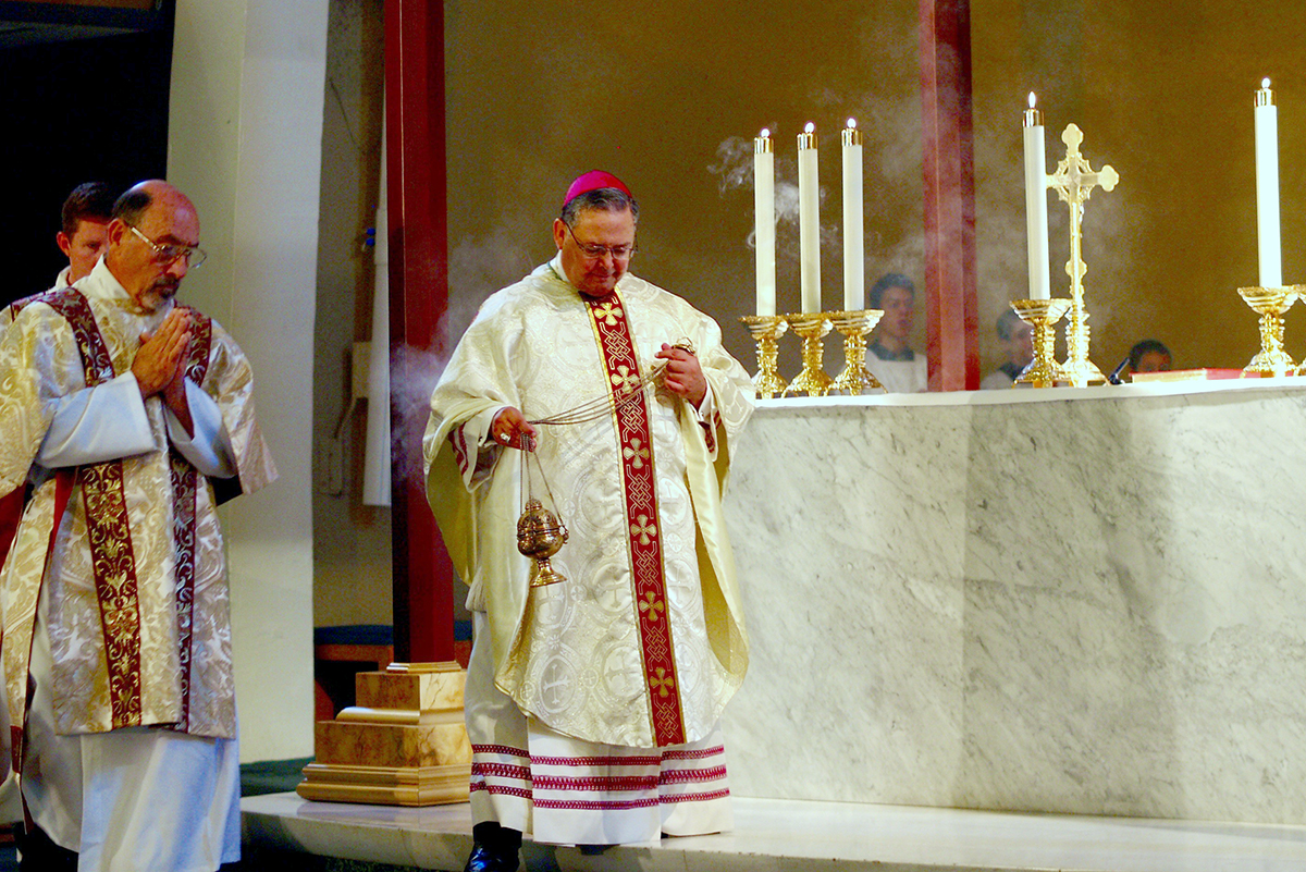 Auxiliary BIshop Eduardo A. Nevares incenses the altar at Ss. Simon and Jude Cathedral during a Fourth of July Mass closing local observances of the Fortnight for Freedom. (Karen Mahoney/CATHOLIC SUN)