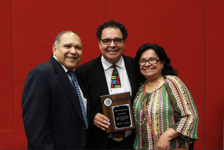 Jaime Cortez, center, is pictured with his parents Jaime and Beatrice, as he proudly displays his National Pastoral Musician of the Year Award. (courtesy photo)