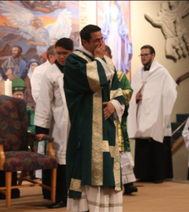 Dcn. Frank Cicero is overwhelmed with emotion at the applause and joy of the people in attendance. (photo courtesy of St. Timothy Parish)
