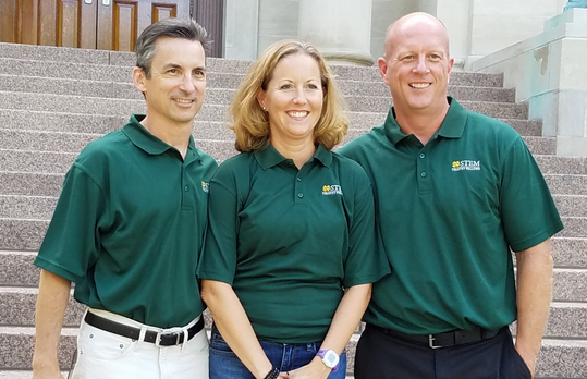 St. John XXIII teachers Dr. Karl Ochsner, Michelle Heitz and Jeff Mitchelson pose during a STEM teaching fellowship at the University of Notre Dame. (photo courtesy of @)