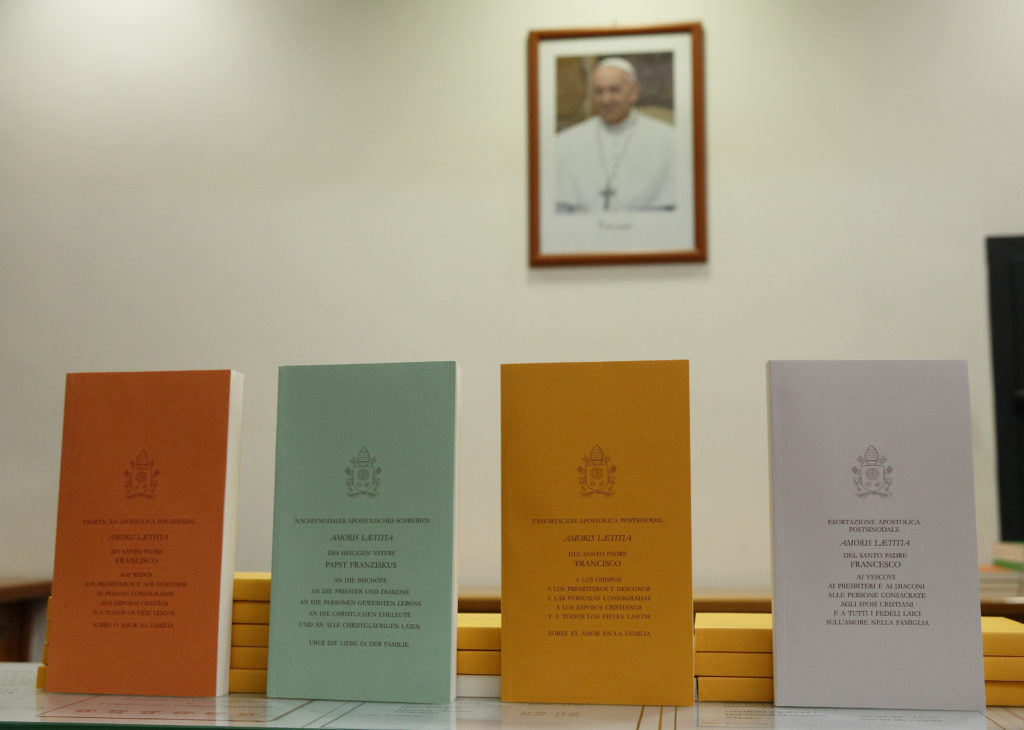Copies of Pope Francis' apostolic exhortation on the family, "Amoris Laetitia" ("The Joy of Love"), are seen during the document's release at the Vatican April 8. The exhortation is the concluding document of the 2014 and 2015 synods of bishops on the family. (CNS photo/Paul Haring) 
