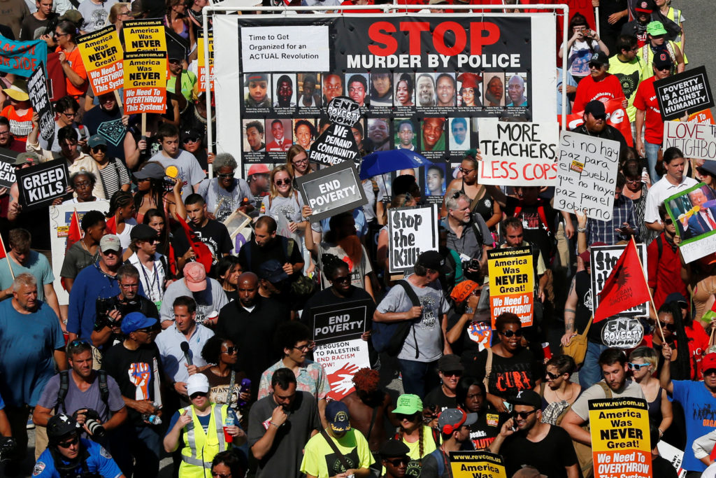 Demonstrators from various groups, including End Poverty Now-March for Economic Justice, gather for a protest July 18 in Cleveland outside the arena where the Republican National Convention was taking place. (CNS photo/Adrees Latif, Reuters)