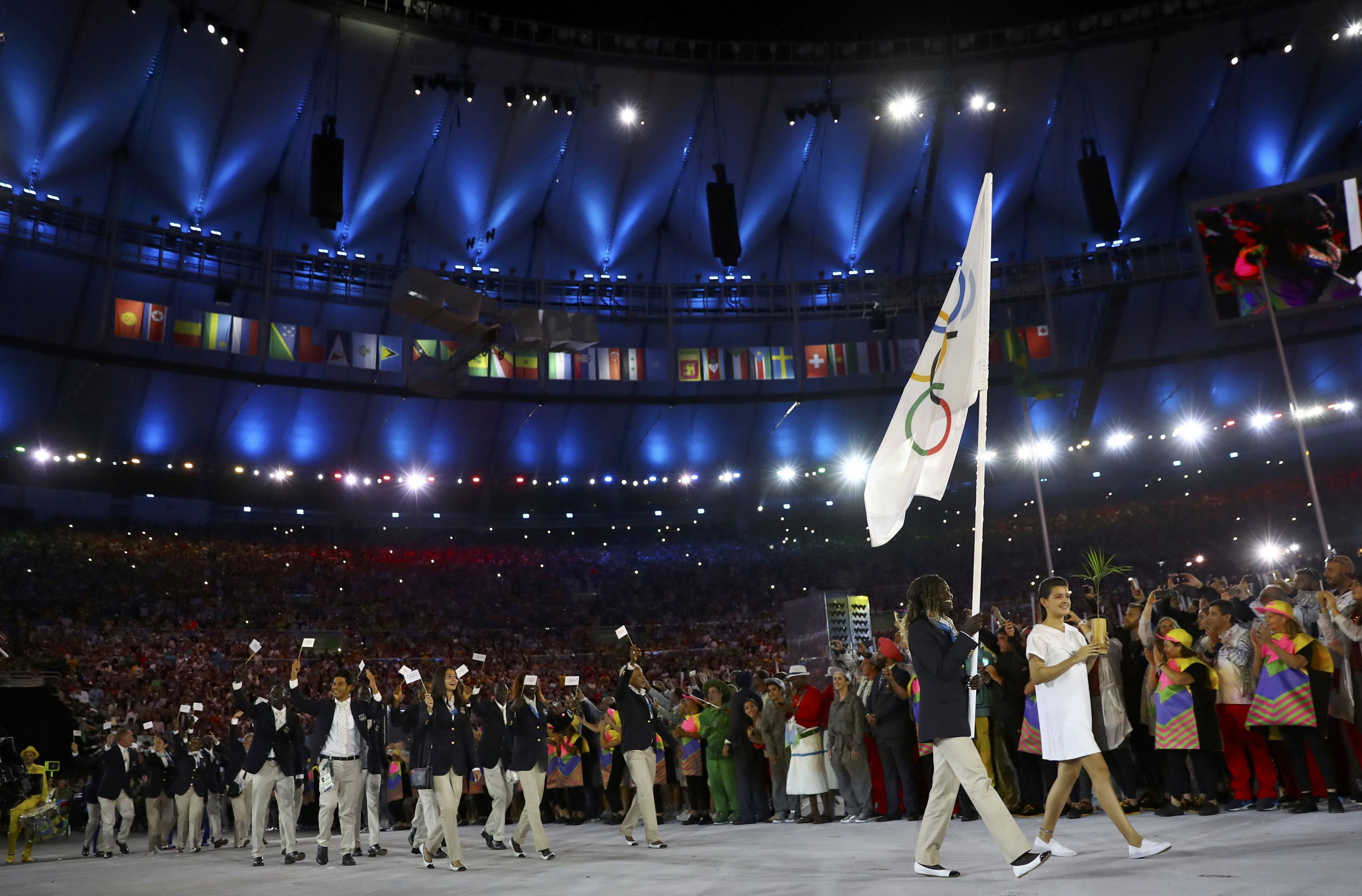 The new Refugee Olympic Team arrives for the opening ceremony in Rio de Janeiro Aug. 5. In a personal message addressed to each of the 10 members of the team, Pope Francis wished them success in their events and thanked them for the witness they are giving the world. (CNS photo/Kai Pfaffenbach, Reuters)