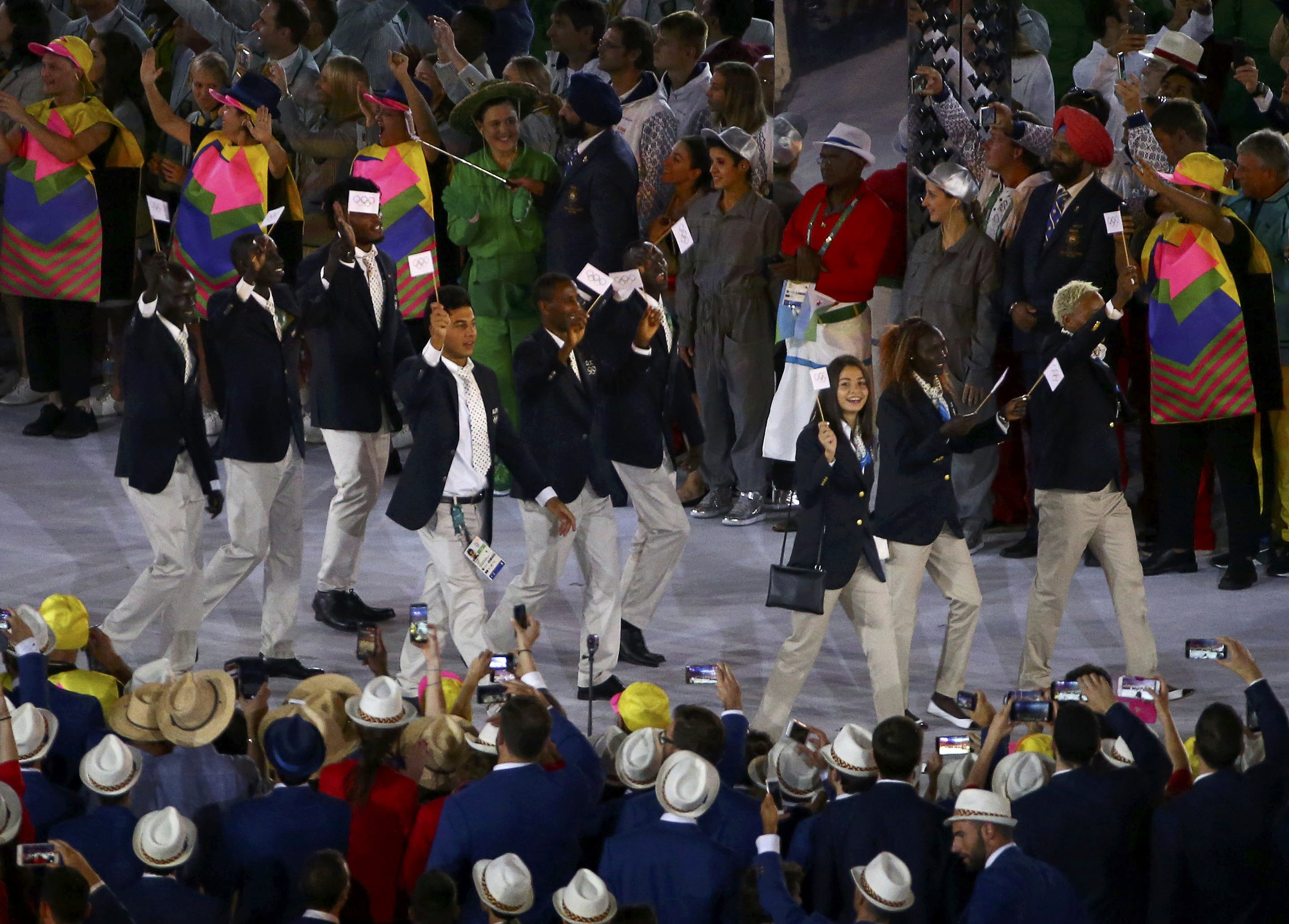 The new Refugee Olympic Team arrives for the opening ceremony in Rio de Janeiro Aug. 5. In a personal message addressed to each of the 10 members of the new Refugee Olympic Team, Pope Francis wished them success in their events and thanked them for the witness they are giving the world. (CNS photo/David Gray, Reuters)