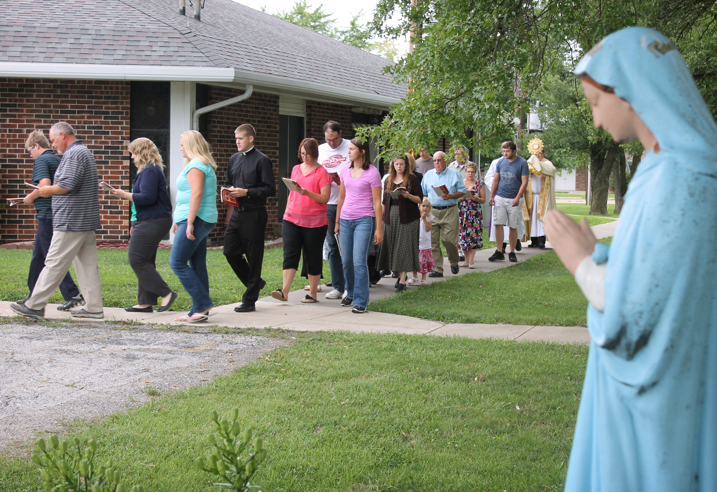 Parishioners walk to Mass at St. Clement Church in St. Clement, Mo., July 30. The church had been vandalized and desecrated the previous Sunday. (CNS photo/Jay Nies, Diocese of Jefferson City)