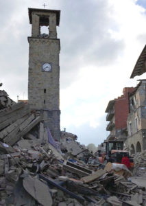 The partially damaged tower bell with the clock signaling the time of the earthquake is seen in Amatrice, Italy, Aug. 24. (CNS photo/Emiliano Grillotti, Reuters) 