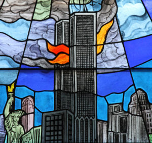 The twin towers of New York's World Trade Center following the Sept. 11 2001 attack is depicted in a stained-glass window at Our Lady of Lourdes Church in the New Dorp Beach section of Staten Island, N.Y. (CNS photo/Gregory A. Shemitz) 