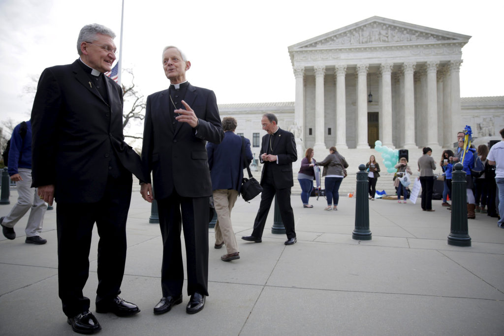 Bishop David A. Zubik of Pittsburgh and Cardinal Donald W. Wuerl of Washington are seen near the U.S. Supreme Court in Washington earlier this year. In its May 16 decision in the Zubik v. Burwell contraceptive mandate case, the high court asked the government and the plaintiffs to work out a solution to providing contraceptives to employees without violating religious employers' moral objections to such coverage. (CNS photo/Joshua Roberts, Reuters) 